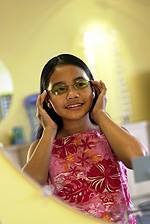 Little girl trying out glasses