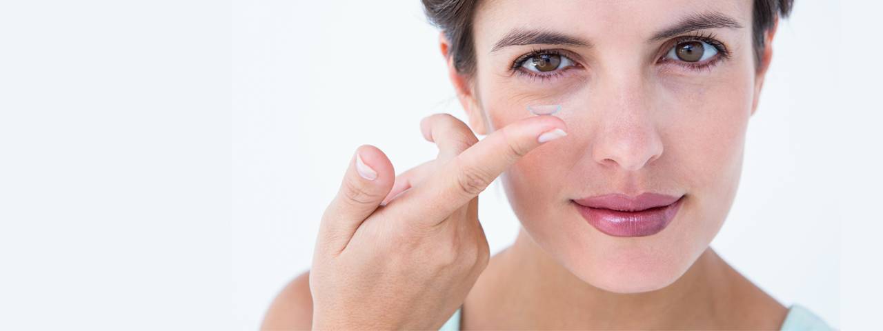 Woman Holding Contact Lens 1280x480