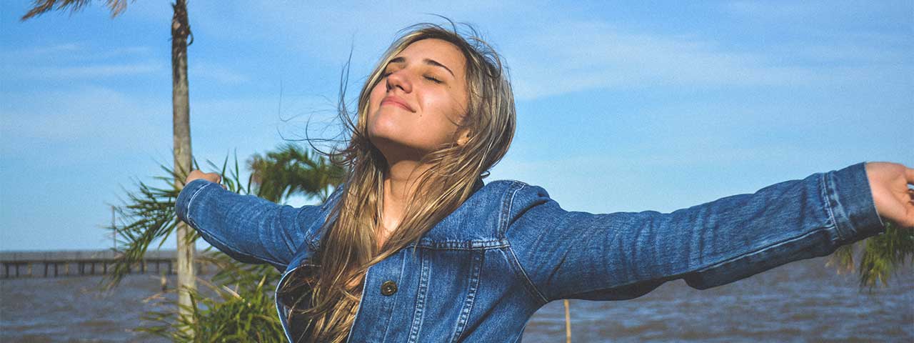 woman breathing fresh air