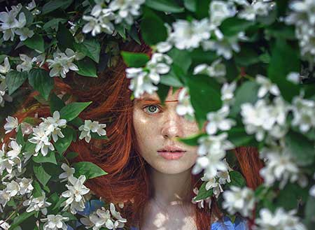 woman behind the flowers