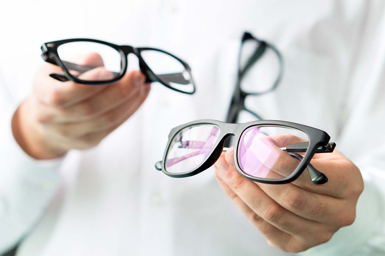 Eye Doctor Showing Eyeglasses