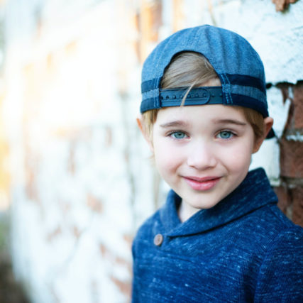 Girl wearing blue baseball cap 640