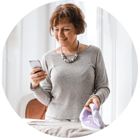 happy senior woman using smartphone.png