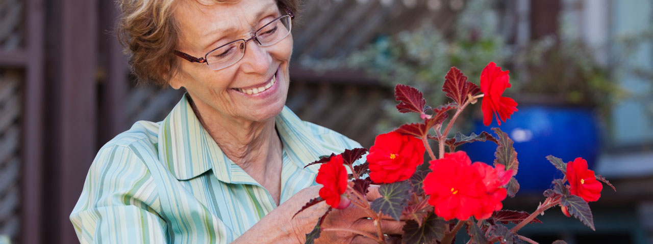 Senior Woman with Flowers 1280x480